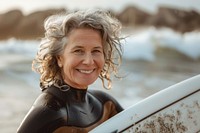 Happy mature female surfer outdoors smile portrait.