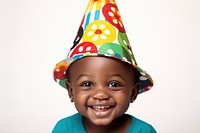 An african amrerican toddler wear party hat portrait smile photo.