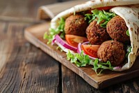 Falafel pita wrap bread food meat.