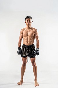 Fullbody Thai boxing pose stand in front of studio clothing apparel person.