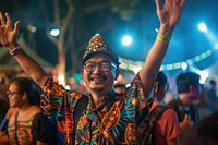 Malay man at a music festival happy celebrating accessories.