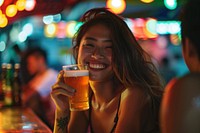 Thai young woman drinking happy beer.
