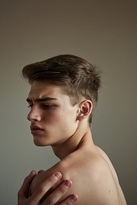 Fullbody Young man having shoulder pain photo photography portrait.