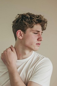 Fullbody Young man having shoulder pain photo photography portrait.