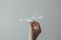A plane paper cut model hand airplane aircraft.