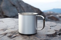 Stainless steel mug mockup rock porcelain beverage.