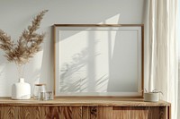 Blank framed photo mockup windowsill painting indoors.
