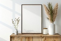 Blank framed photo mockup cabinet furniture indoors.