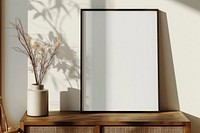 Blank framed photo mockup furniture mirror plant.