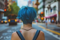 Woman blue pixie cut hairstyles street transportation individuality.