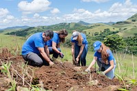 Group of people planting gardening clothing.