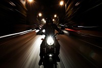 Motorcycle on road headlight lighting vehicle.