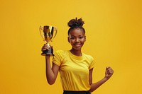 Photo of an black athlete woman raising a gold trophy triumphant surprised person.