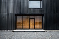 Photo of standalone warehouse building door architecture.