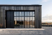 Photo of standalone warehouse building architecture outdoors.