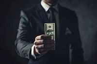 A business man holding dollar money monochrome currency.