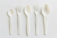 Brand new plastic utensils spoon white fork.