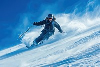 Skier carving down recreation outdoors clothing.