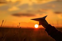 Paper plane silhouette photography backlighting outdoors nature.