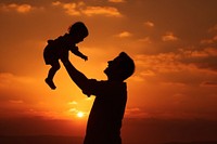 Person holding baby silhouette photography backlighting outdoors nature.