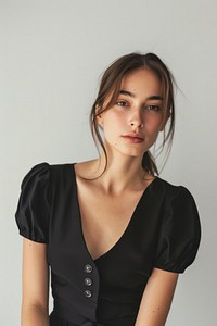 Portrait woman in studio portrait sleeve blouse.