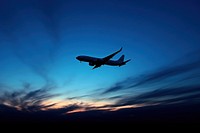 Plane silhouette photography transportation aircraft airliner.