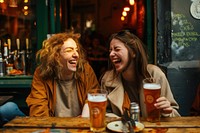 Two happy female having meal and beer and laughing glass drink party.