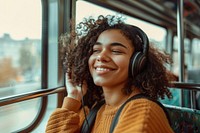 Happy young Ansian woman with curly hair wearing headphones happy electronics dimples.