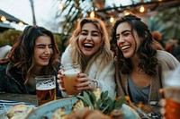 Happy Female Friends Having meal And Beer And Laughing laughing beer female.