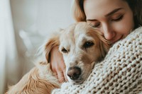 Person hugging a dog mammal blanket female.