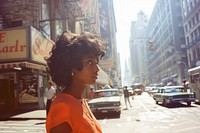 A black woman portrait fashion standing at street transportation automobile vehicle.