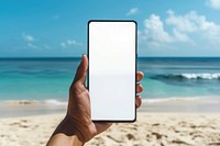 Blank smartphone mockup photo beach electronics.