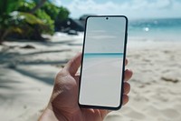 Blank smartphone mockup beach electronics shoreline.