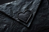 Envelope black heart shape monochrome.