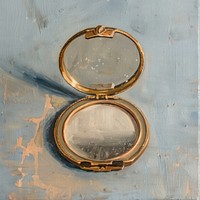 Vintage powder compact with mirror jewelry locket accessories.