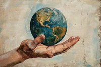 Clsoe up on pale hand holding earth painting planet adult.