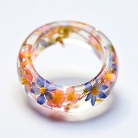 Flowers in ring resin jewelry white background accessories.