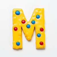 Letter M cookie art dessert candy icing.