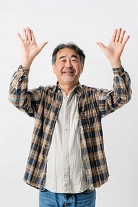 Japanese middle age man raising hands portrait adult photo.