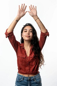 Maxican young adult woman raising hands portrait blouse photo.