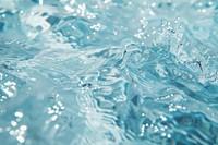 Water flowing down droplet blue sea.