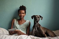 Young black woman animal dog sitting.