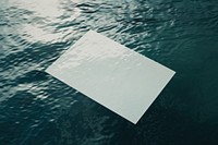 Poster floating on water surface mockup outdoors paper transportation.