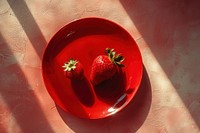 Strawberry in red plate fruit plant food.