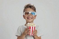 Happy boy holding popcorn bucket person human smile.