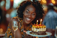 Woman African impressed with birthday cake happy dessert wedding.