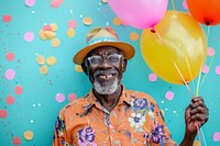 Elderly African man holding balloons happy laughing person.
