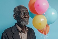 Lovely elderly African man holding balloons happy person human.
