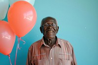 Lovely elderly African man holding balloons happy accessories accessory.