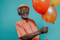 Elderly African man holding balloons happy person adult.